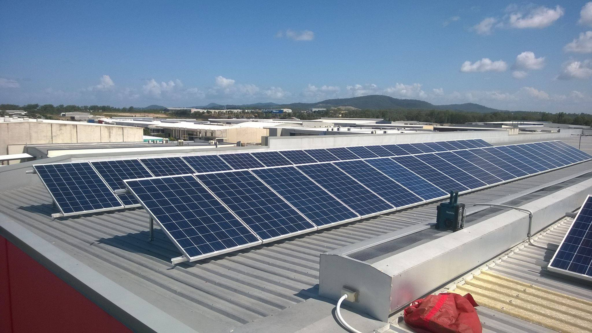 2 lines of solar panels on flat grey roof